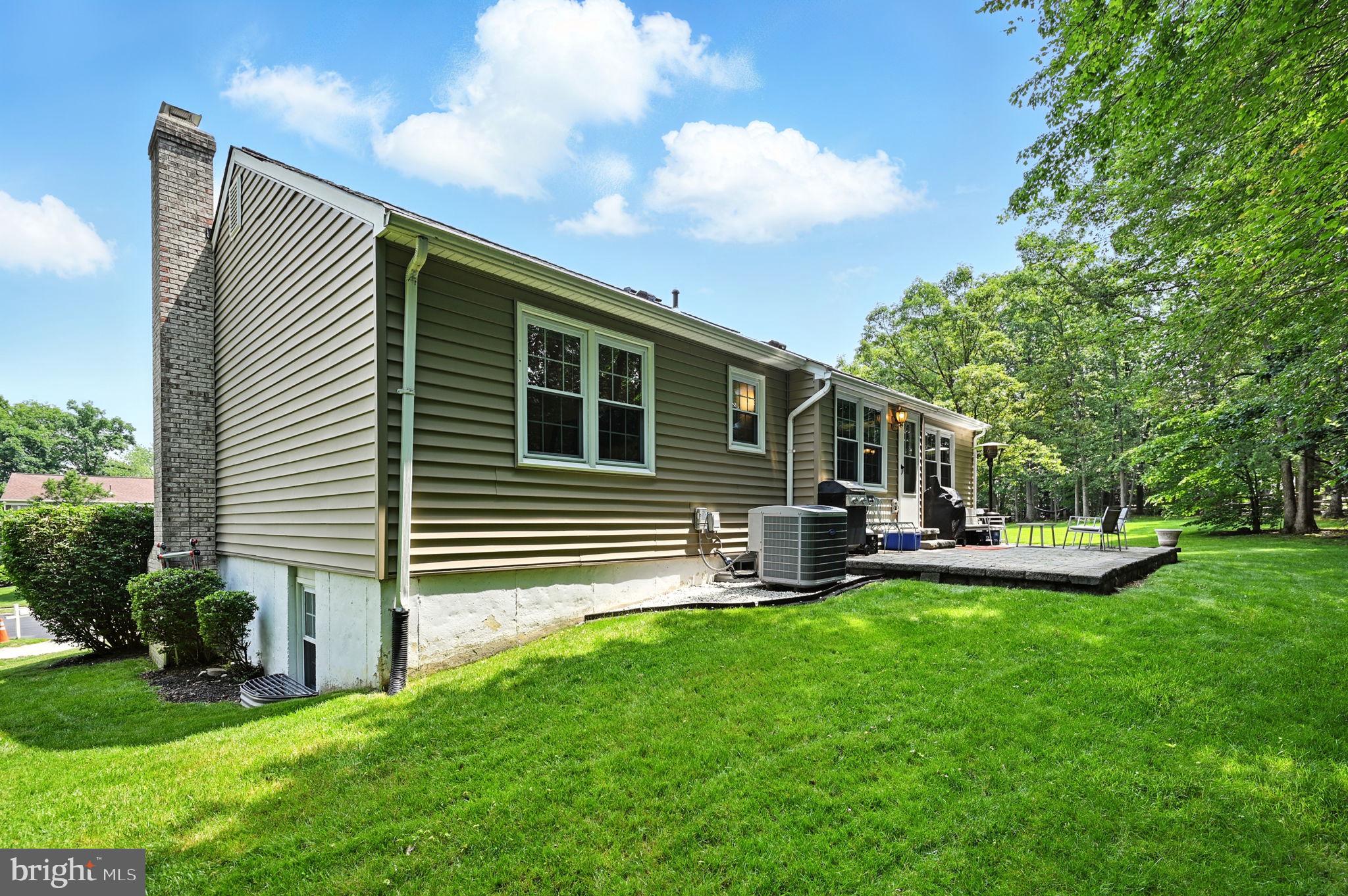 8923 Renshaw Court Springfield, VA 22153 - Photo 35 of 38 a house view with a sitting space and garden