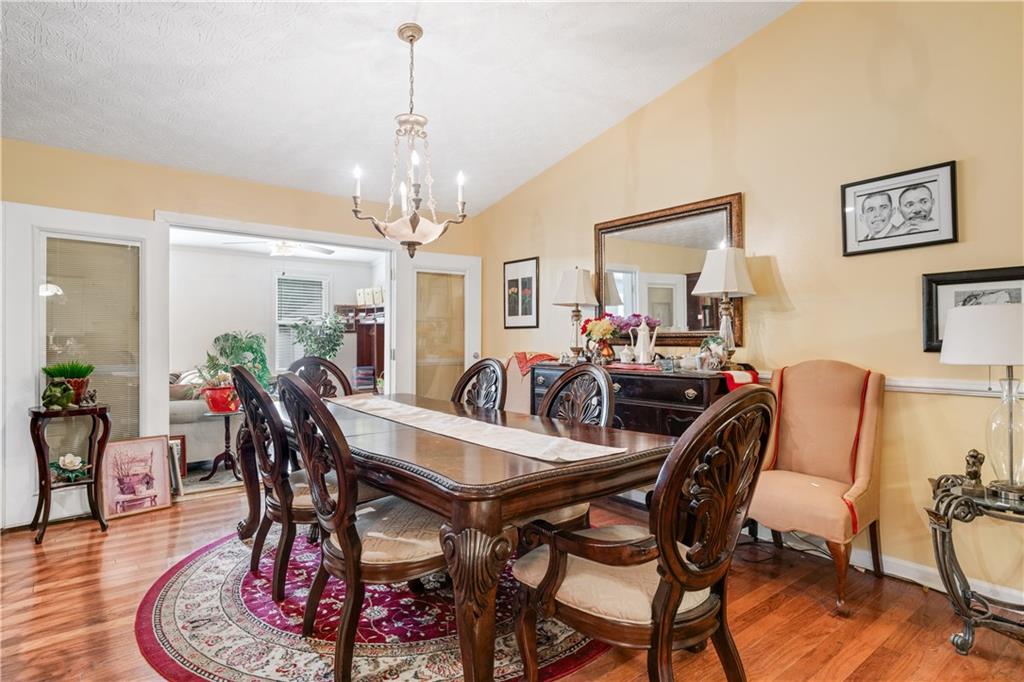 3960 Highway 20 Conyers, GA 30013 - Photo 13 of 57 a view of a dining room with furniture and wooden floor
