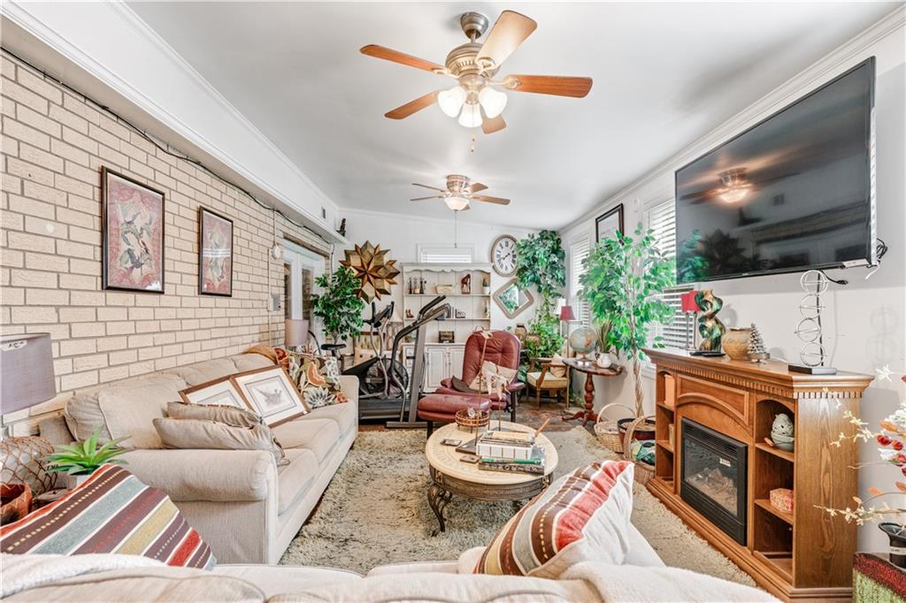 3960 Highway 20 Conyers, GA 30013 - Photo 14 of 57 a living room with patio furniture and a flat screen tv