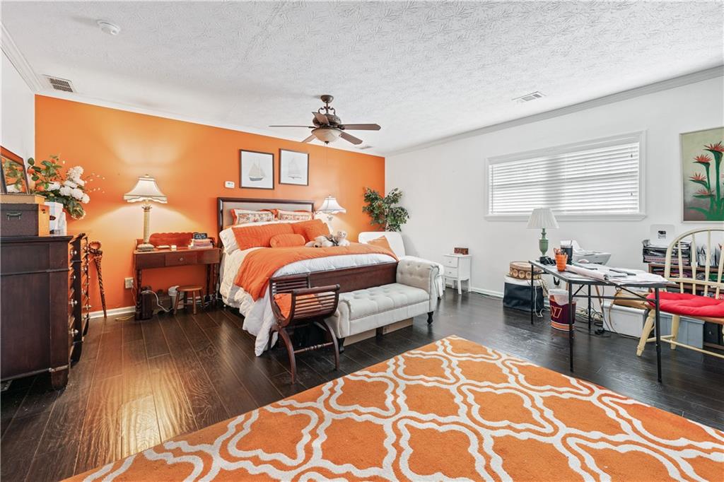 3960 Highway 20 Conyers, GA 30013 - Photo 17 of 57 a bedroom with furniture and a wooden floor