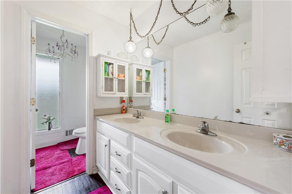 3960 Highway 20 Conyers, GA 30013 - Photo 24 of 57 a spacious bathroom with a double vanity sink mirror and double