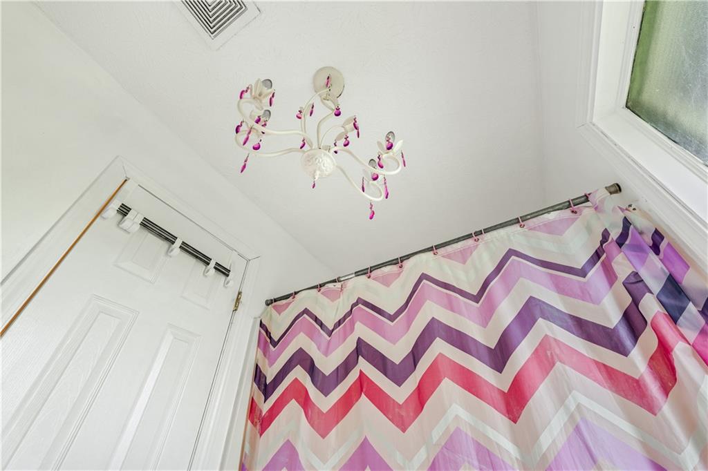 3960 Highway 20 Conyers, GA 30013 - Photo 25 of 57 a utility room with a bed and a white walls