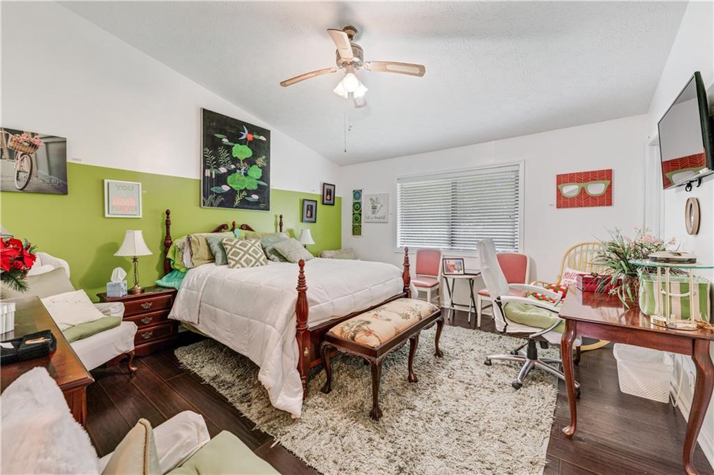 3960 Highway 20 Conyers, GA 30013 - Photo 26 of 57 a living room with furniture and a chandelier