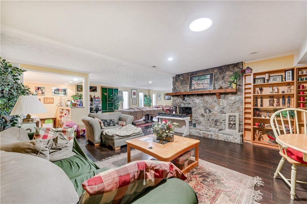 3960 Highway 20 Conyers, GA 30013 - Photo 29 of 57 a living room with furniture and a wooden floor