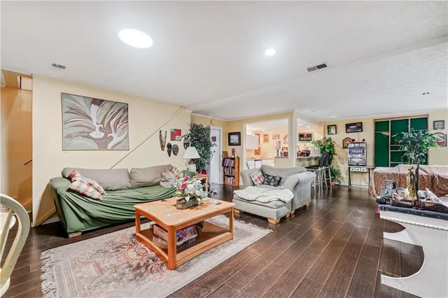 a spacious bedroom with a bed and large windows