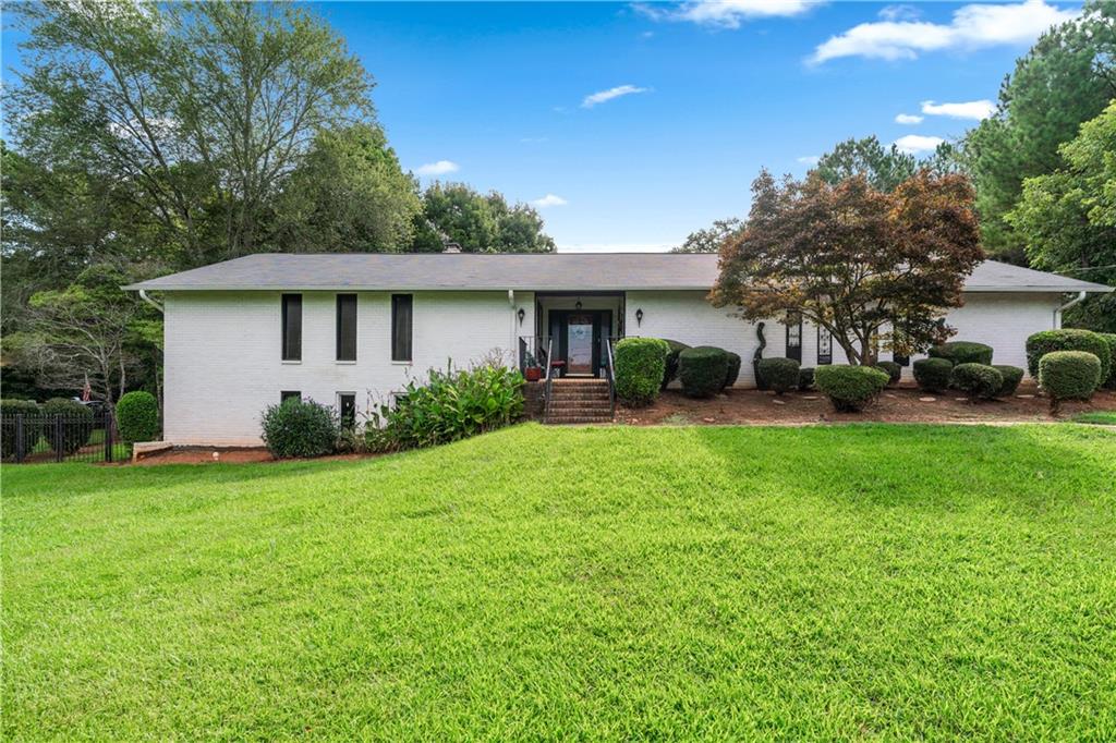 3960 Highway 20 Conyers, GA 30013 - Photo 3 of 57 a view of a house with backyard and garden