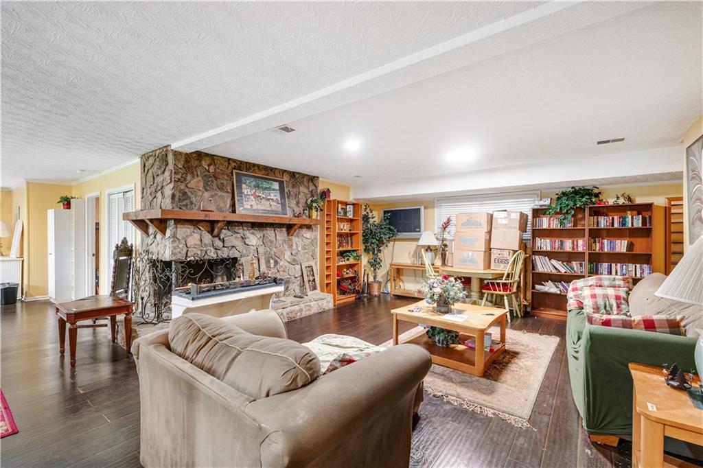 3960 Highway 20 Conyers, GA 30013 - Photo 33 of 57 a living room with furniture and a fireplace