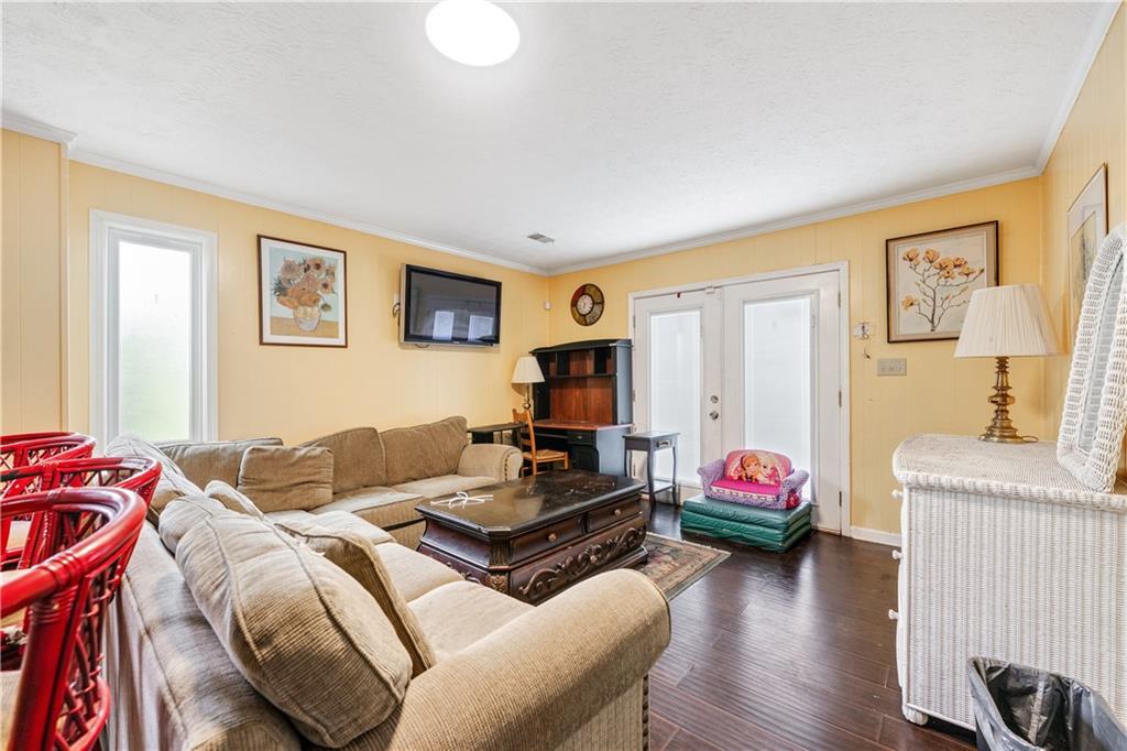 3960 Highway 20 Conyers, GA 30013 - Photo 36 of 57 a living room with furniture and a flat screen tv