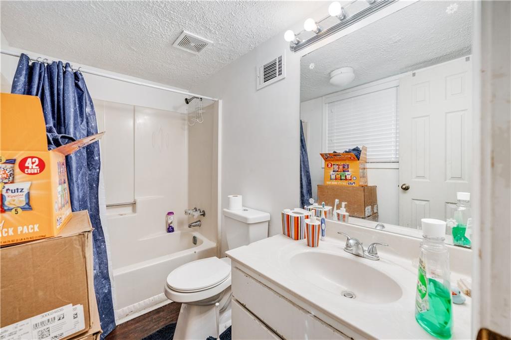 3960 Highway 20 Conyers, GA 30013 - Photo 39 of 57 a bathroom with a sink a toilet and shower