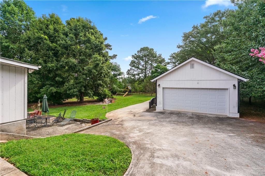3960 Highway 20 Conyers, GA 30013 - Photo 48 of 57 a view of a house with backyard and garden