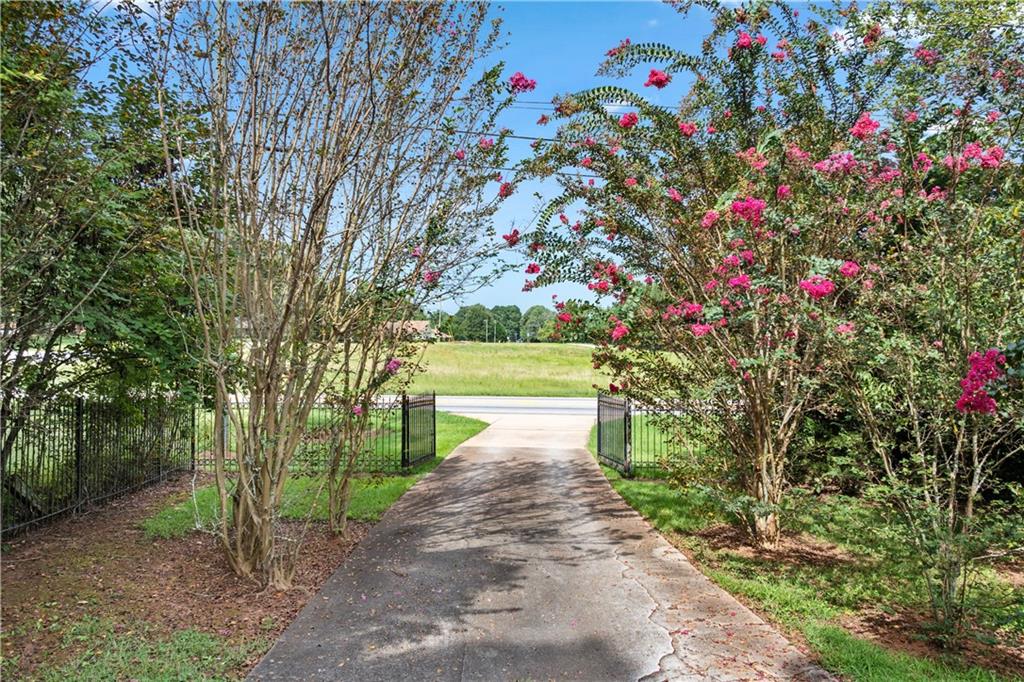 3960 Highway 20 Conyers, GA 30013 - Photo 50 of 57 a pathway of a house with a yard and garden