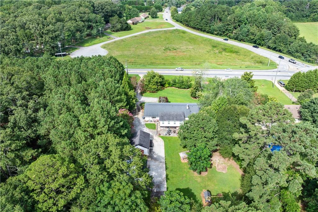 3960 Highway 20 Conyers, GA 30013 - Photo 54 of 57 an aerial view of residential houses with outdoor space and trees all around