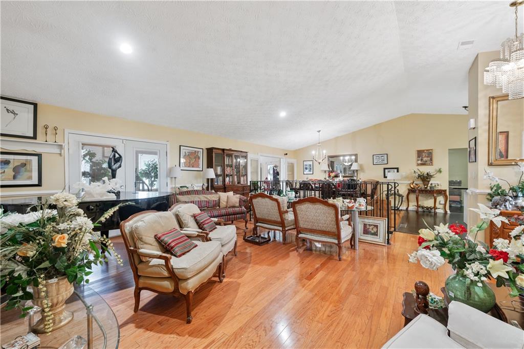 3960 Highway 20 Conyers, GA 30013 - Photo 8 of 57 a living room with lots of furniture and a painting on the wall