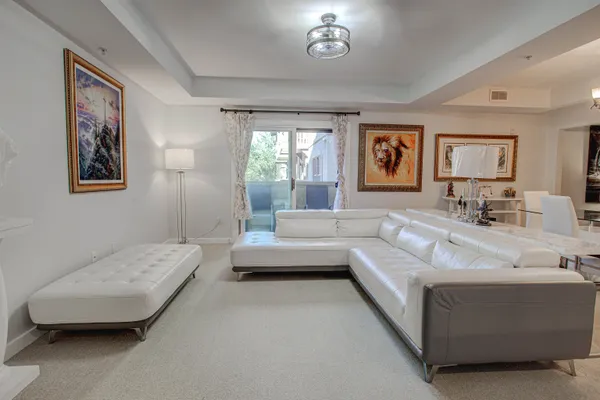 a living room with furniture and a large window