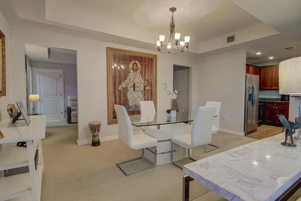 a kitchen with stainless steel appliances granite countertop a refrigerator and a sink