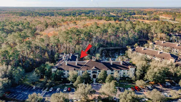 an aerial view of house with outdoor space and swimming pool