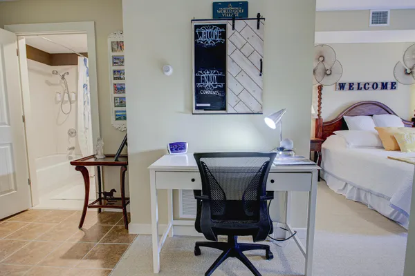 a bedroom with a bed dresser and a window
