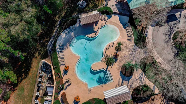 an aerial view of a house with a garden