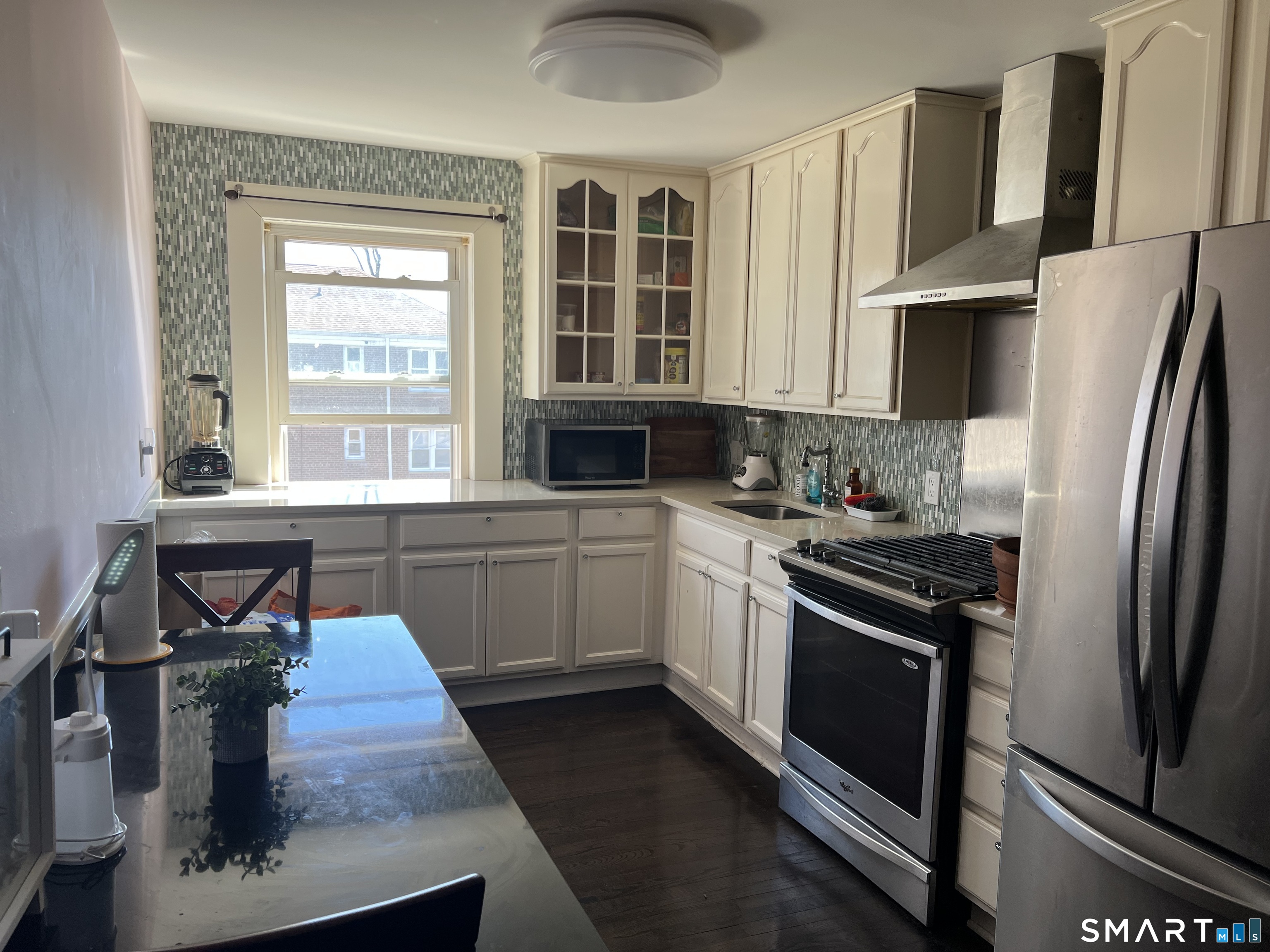 37 Canaan Court, Unit 22 Stratford, CT 06614 - Photo 16 of 16 a kitchen with stainless steel appliances granite countertop a sink stove and refrigerator