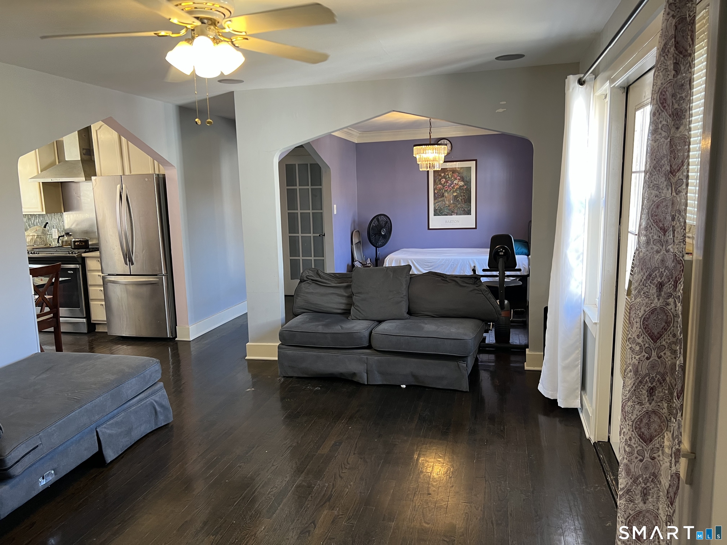 37 Canaan Court, Unit 22 Stratford, CT 06614 - Photo 3 of 16 a living room with furniture and a chandelier