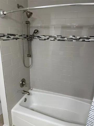 a view of a field of grass and trees