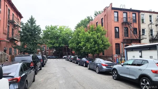 a view of car parked in front of building