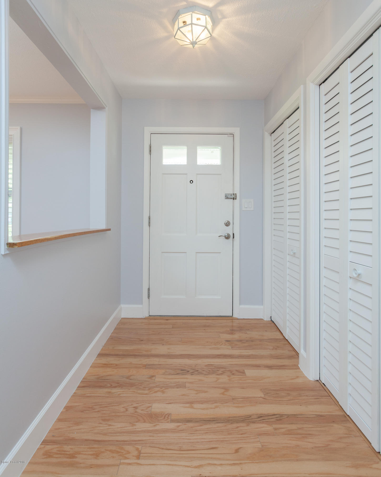 731 Java Road Cocoa Beach, FL 32931 - Photo 2 of 18 a view of a livingroom with wooden floor