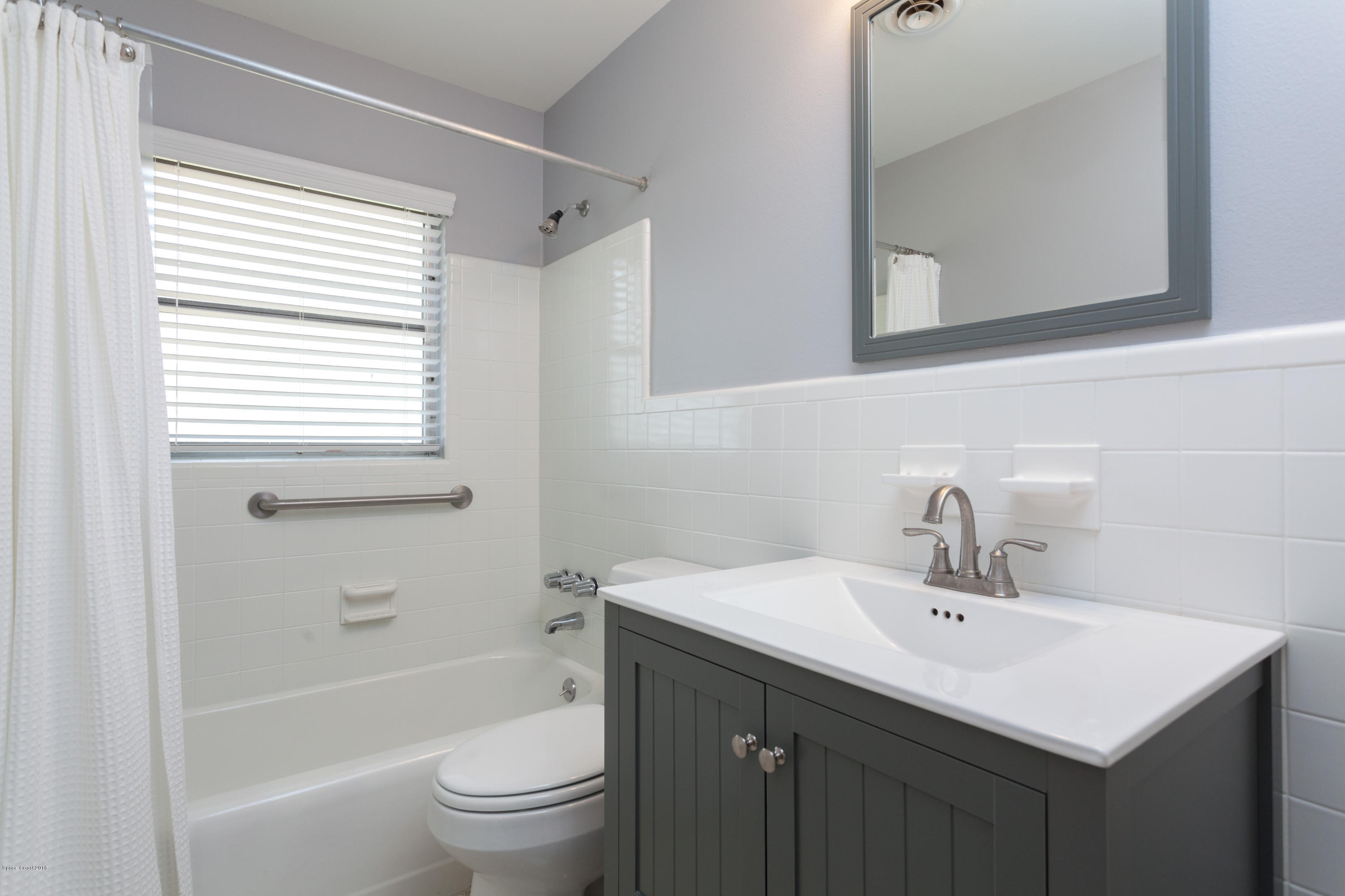 731 Java Road Cocoa Beach, FL 32931 - Photo 13 of 18 a bathroom with a sink a toilet and a bathtub