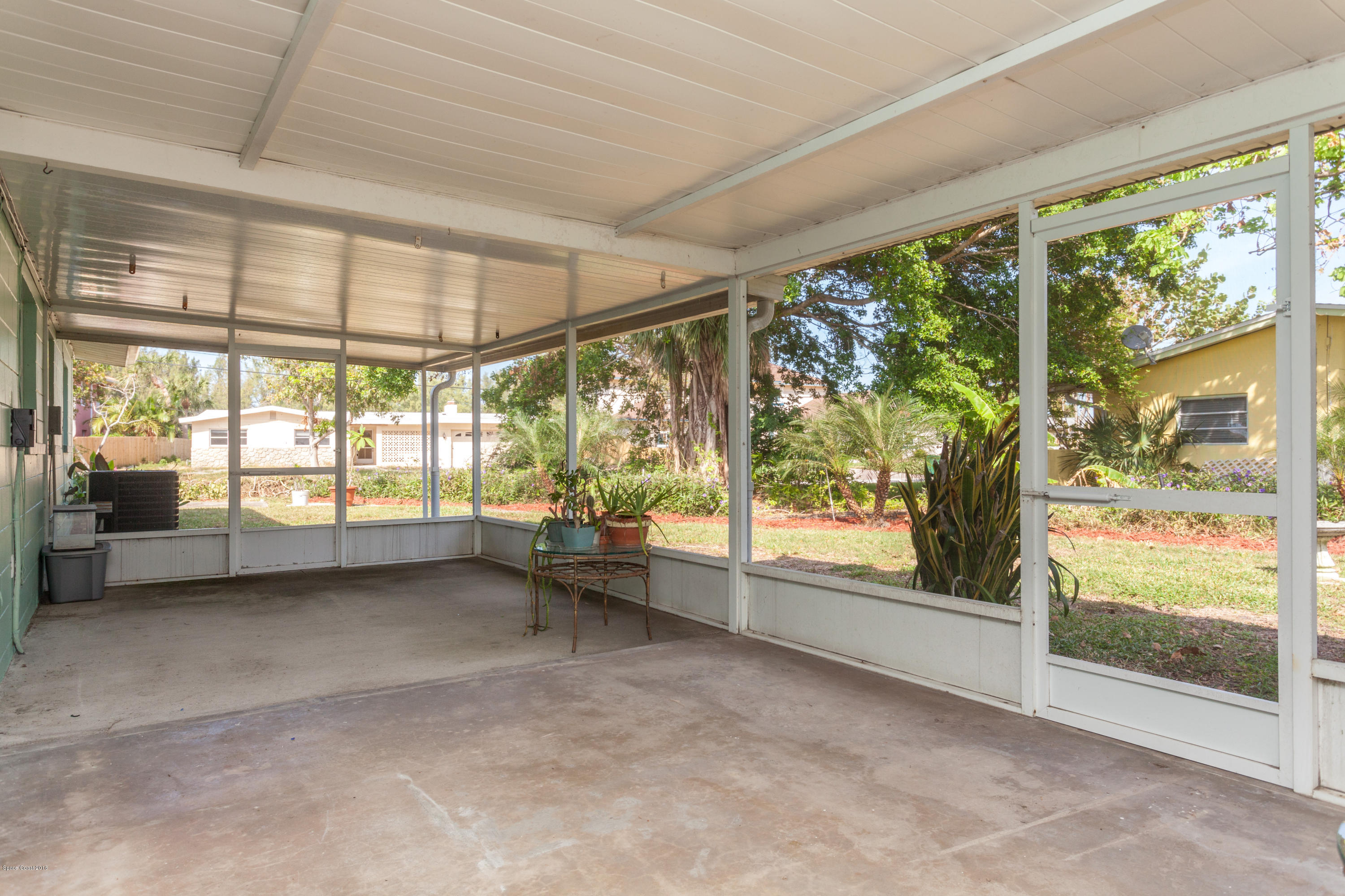 731 Java Road Cocoa Beach, FL 32931 - Photo 14 of 18 a view of room with window and floor to ceiling window