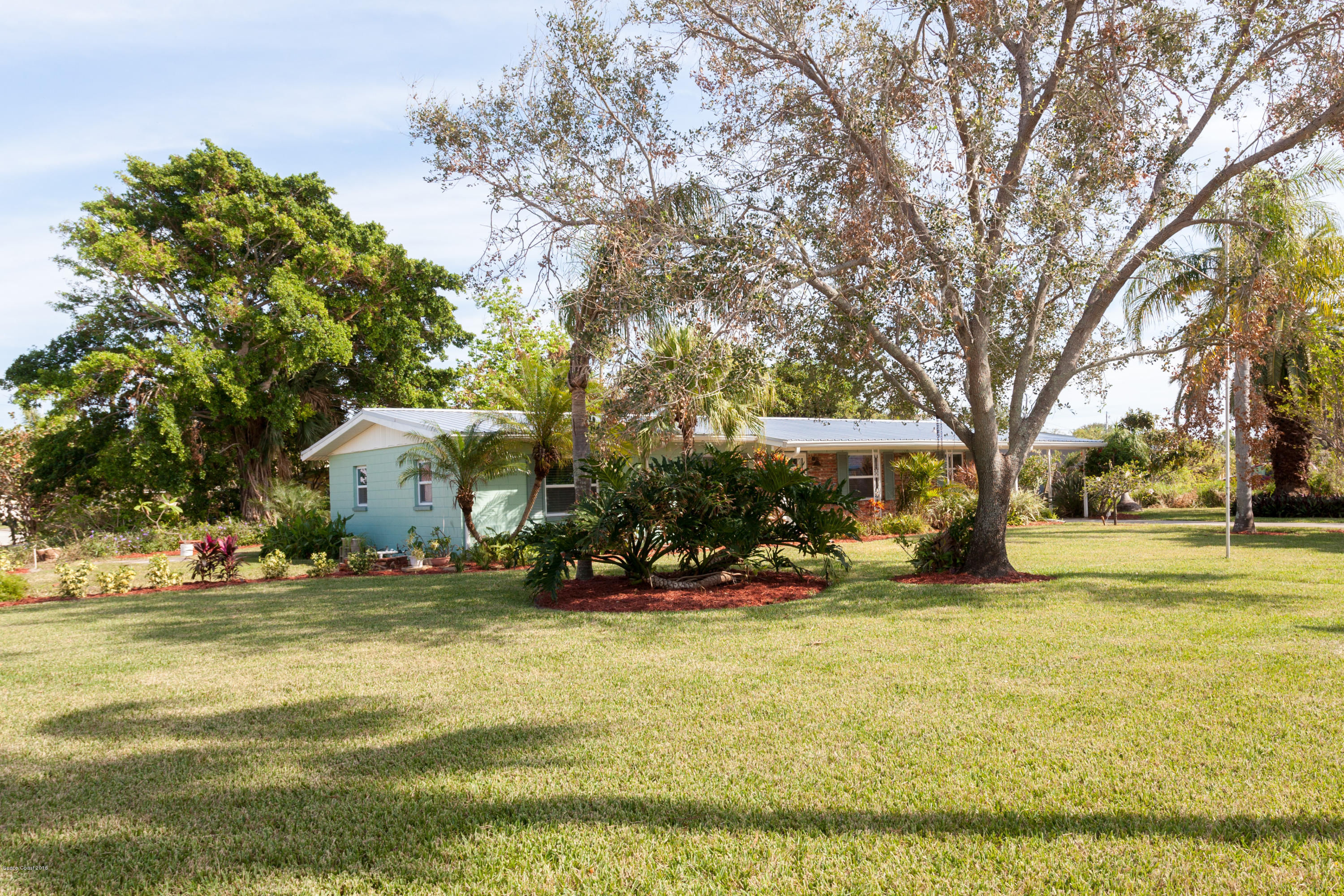 731 Java Road Cocoa Beach, FL 32931 - Photo 16 of 18 a view of a house with yard and sitting area