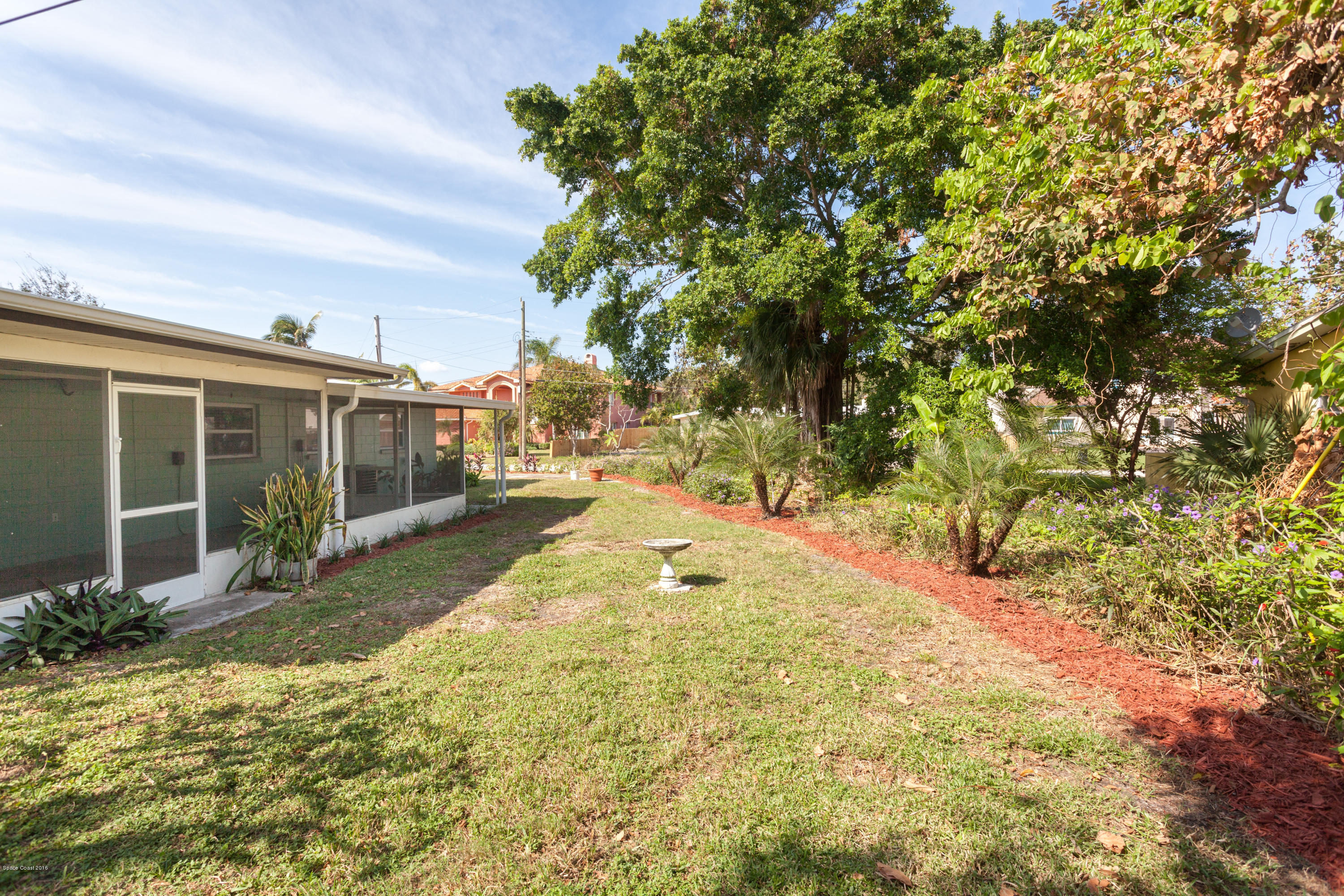 731 Java Road Cocoa Beach, FL 32931 - Photo 17 of 18 a view of backyard of the house