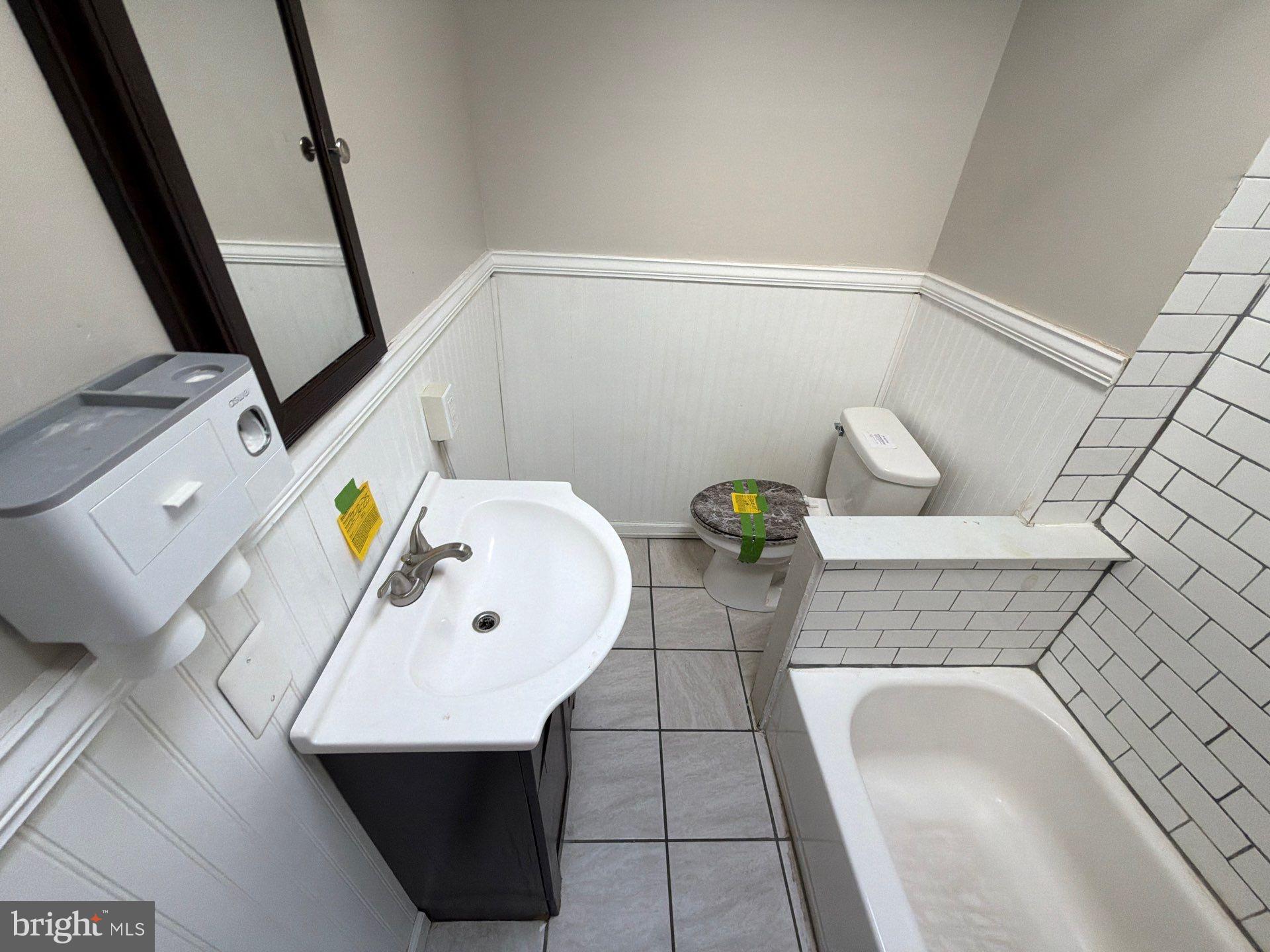 5540 Crowson Street Philadelphia, PA 19144 - Photo 7 of 11 a bathroom with a sink and mirror