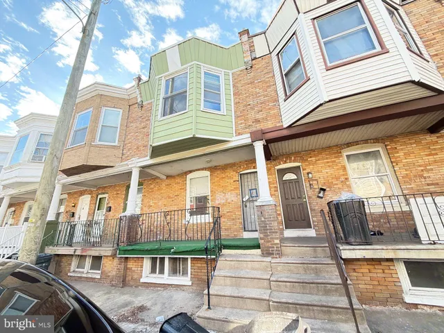 a front view of a building with glass windows