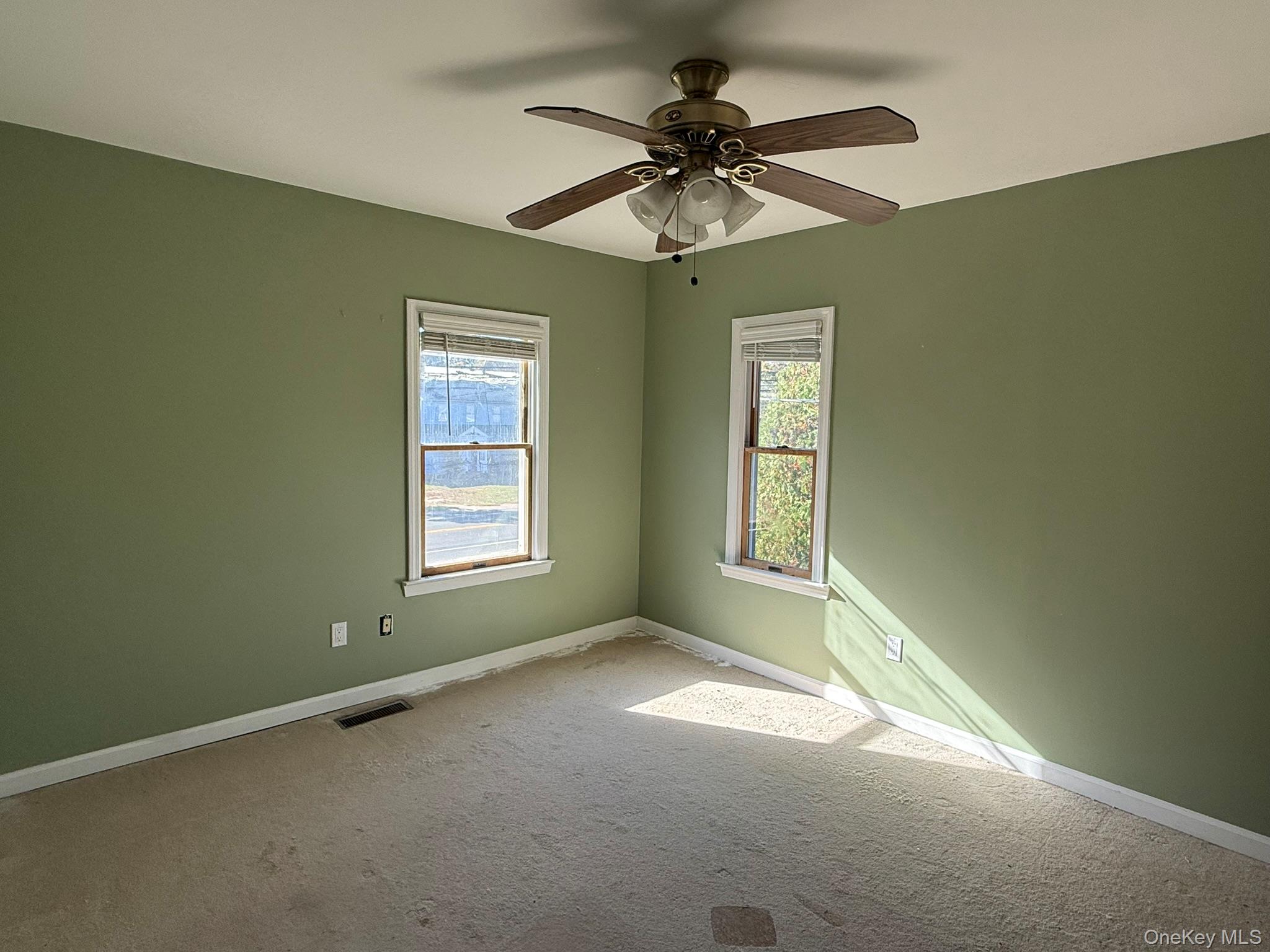 11005 Main Road East Marion, NY 11939 - Photo 14 of 26 a view of an empty room with a window