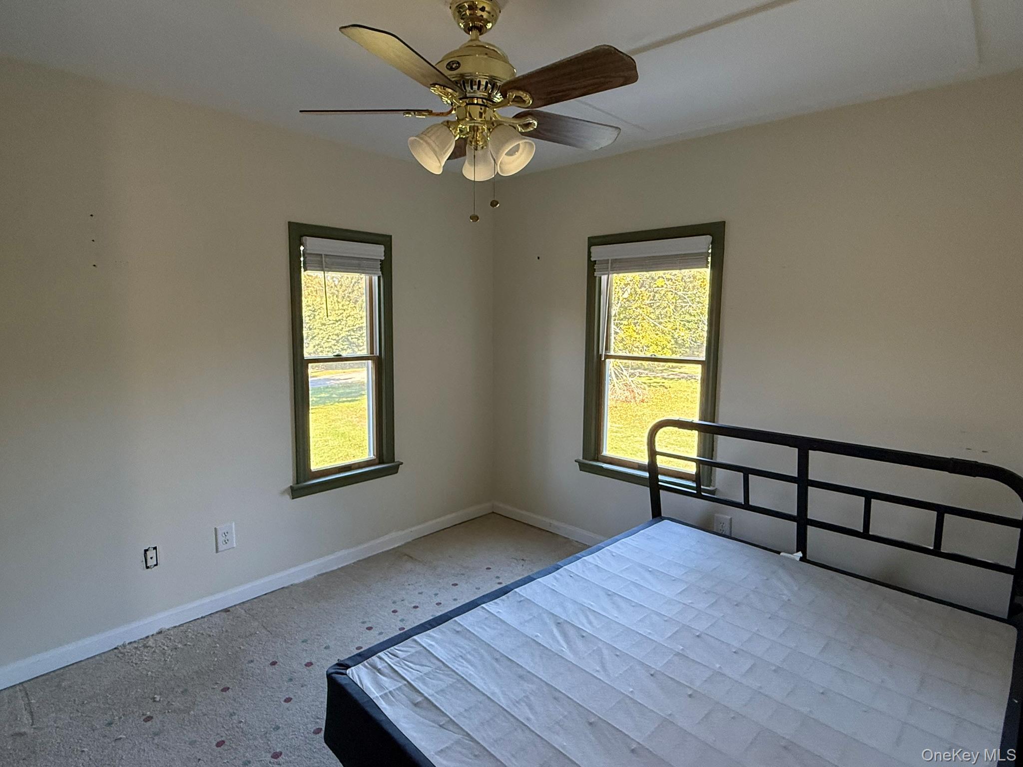 11005 Main Road East Marion, NY 11939 - Photo 15 of 26 a view of an empty room with a window