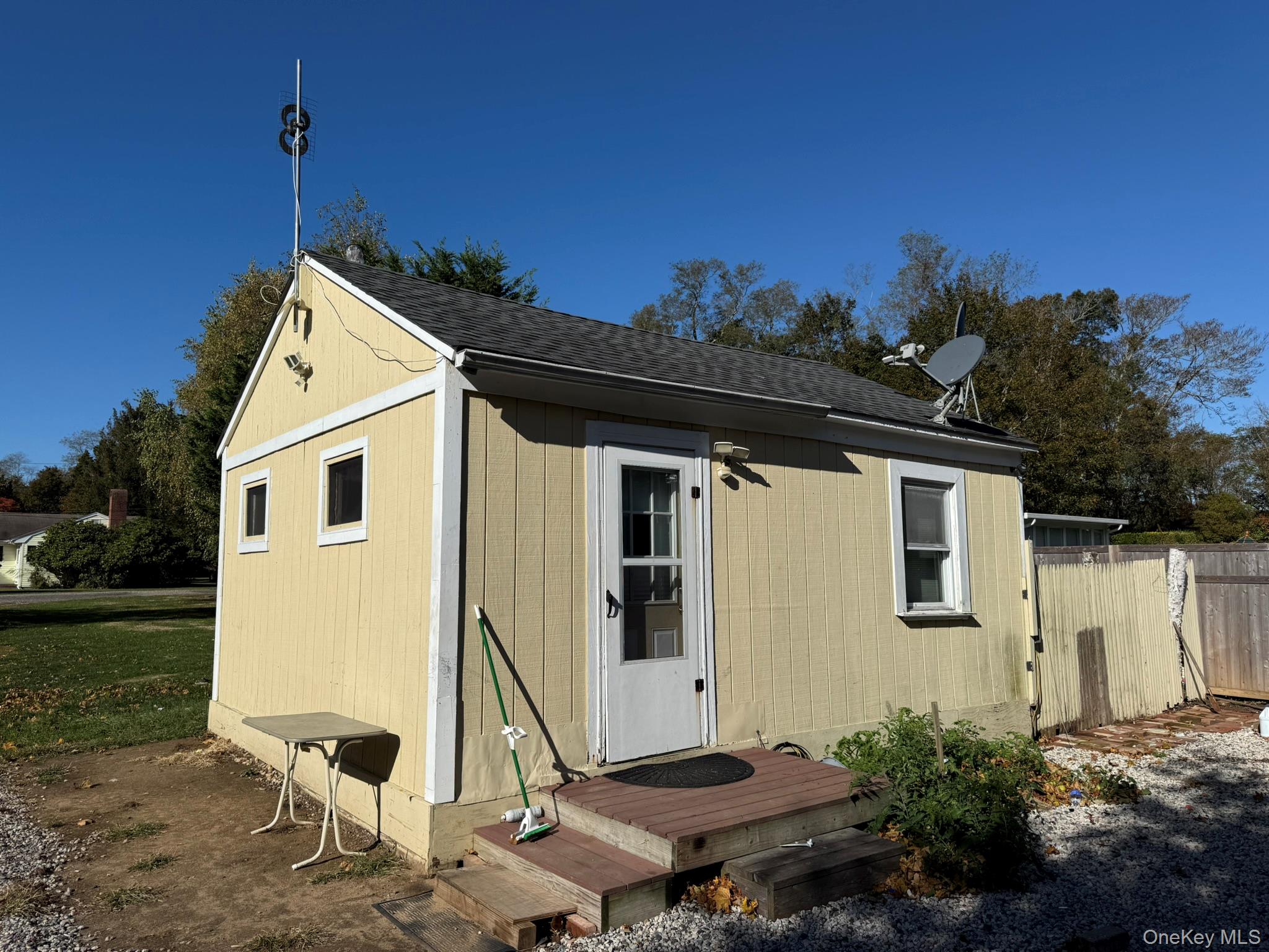 11005 Main Road East Marion, NY 11939 - Photo 20 of 26 a front view of a house with garden