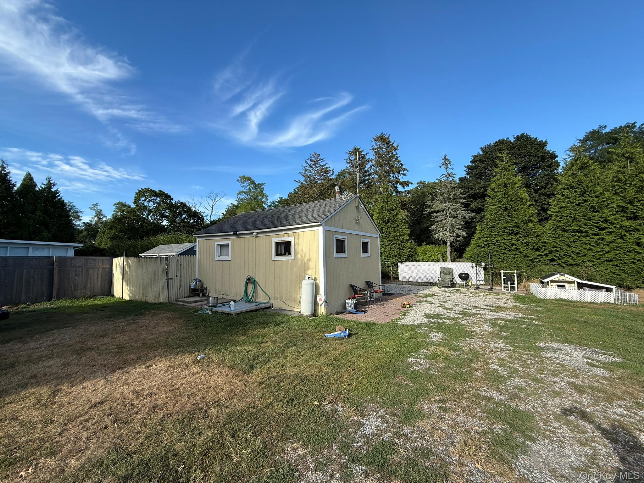 11005 Main Road East Marion, NY 11939 - Photo 21 of 26 a house view with a backyard space