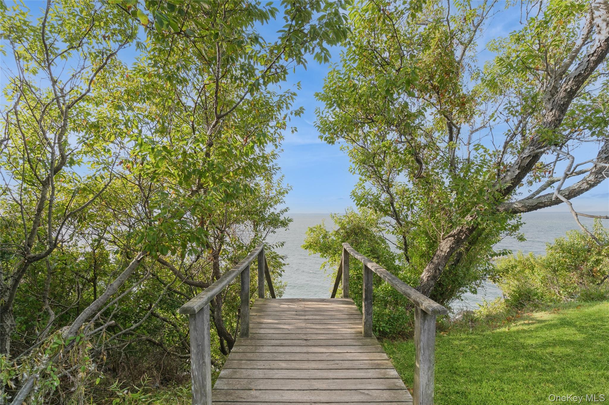 11005 Main Road East Marion, NY 11939 - Photo 23 of 26 a view of a house with a tree