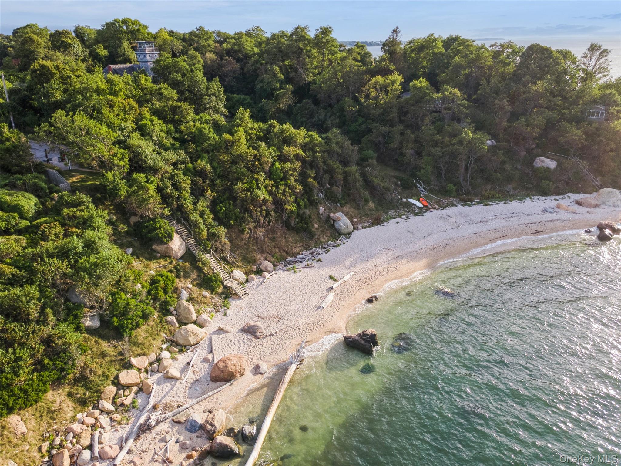 11005 Main Road East Marion, NY 11939 - Photo 25 of 26 a view of a yard with a tree