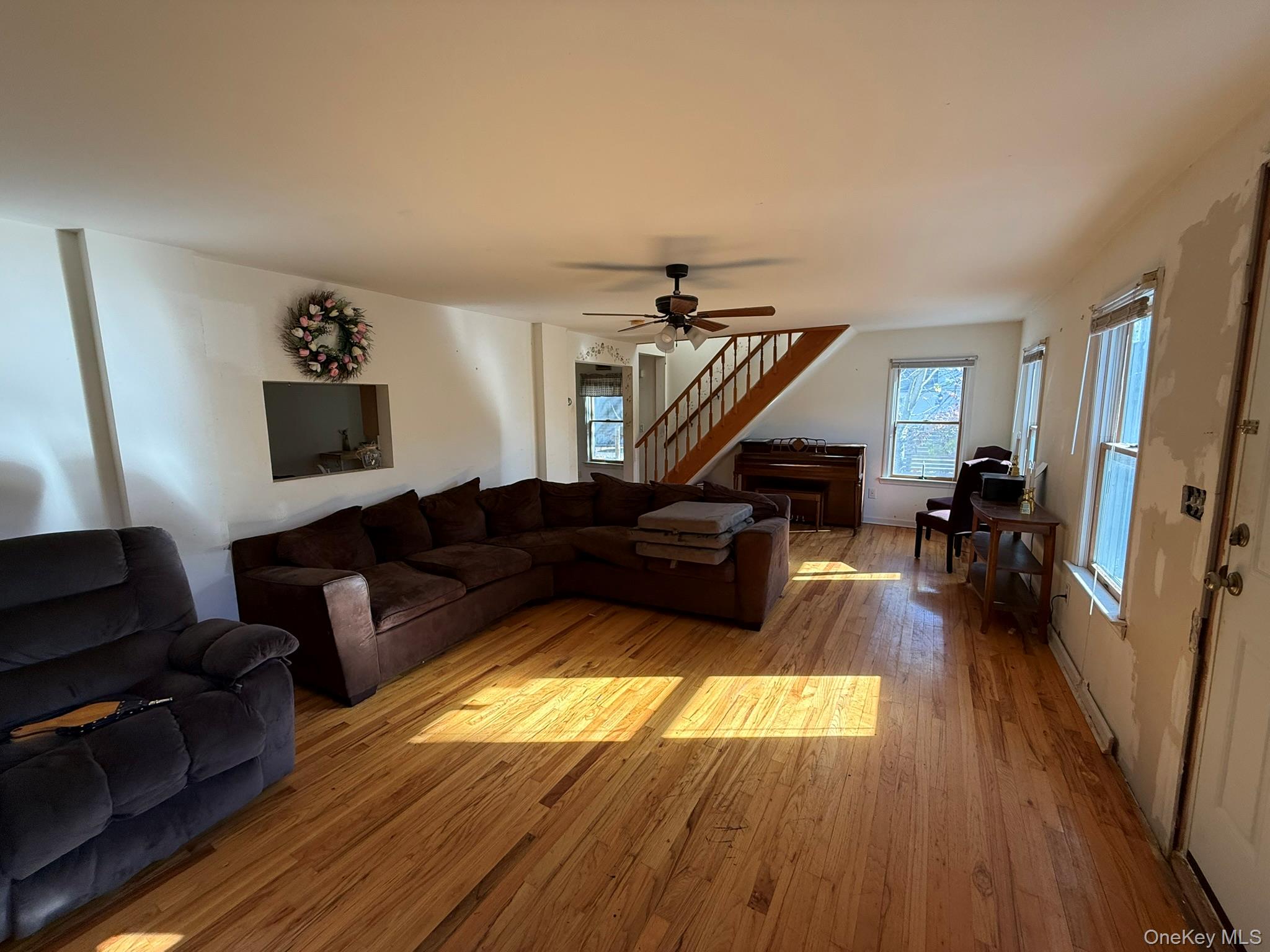 11005 Main Road East Marion, NY 11939 - Photo 4 of 26 a living room with furniture and a wooden floor