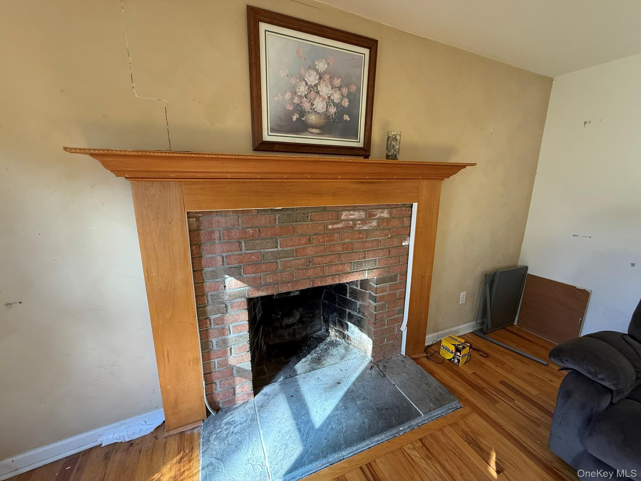11005 Main Road East Marion, NY 11939 - Photo 5 of 26 a living room with furniture and a fireplace