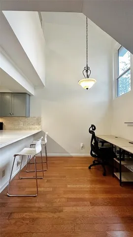 a room with gym equipment and view of living room