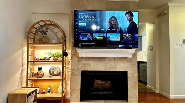 a view of living room with furniture and fireplace