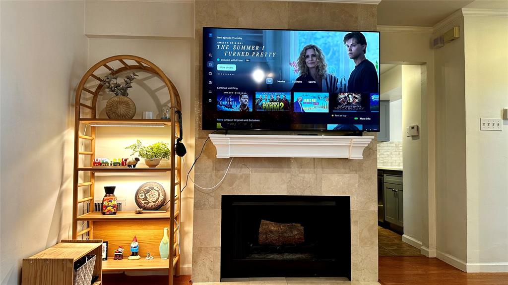 18240 Midway Road, Unit 104 Dallas, TX 75287 - Photo 2 of 22 a view of living room with furniture and fireplace