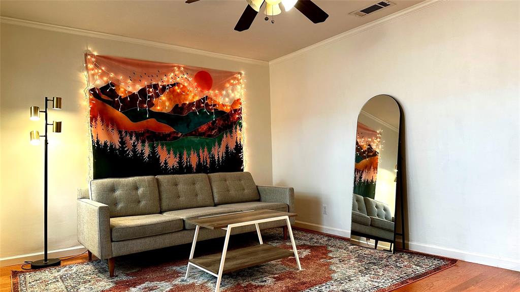 18240 Midway Road, Unit 104 Dallas, TX 75287 - Photo 3 of 22 a living room with furniture a rug and a window