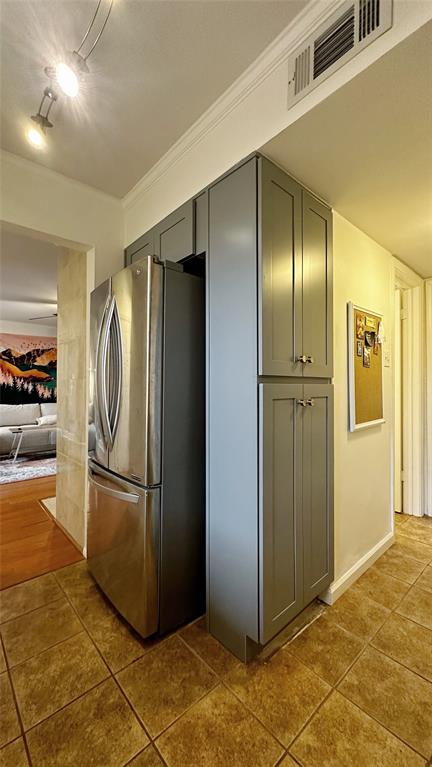 18240 Midway Road, Unit 104 Dallas, TX 75287 - Photo 6 of 22 a kitchen with stainless steel appliances granite countertop a refrigerator and a sink