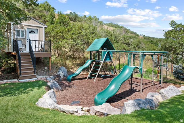 288 South Hillside Drive Elk Ridge, UT 84651 - Photo 24 of 27 Custom playhouse is well built with its own dek and electricity. Sturdy solid custom playground