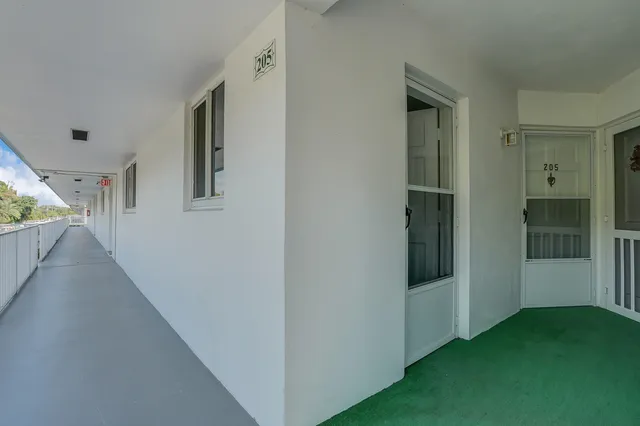 a view of a hallway with closet and entryway