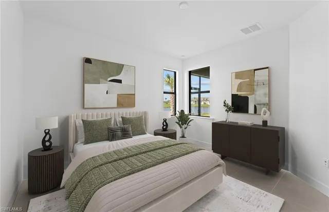 a bedroom with a bed and a couch