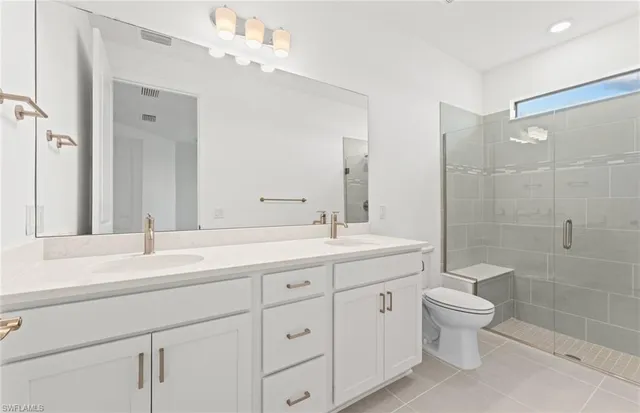 a view of walk in closet with racks on the wall